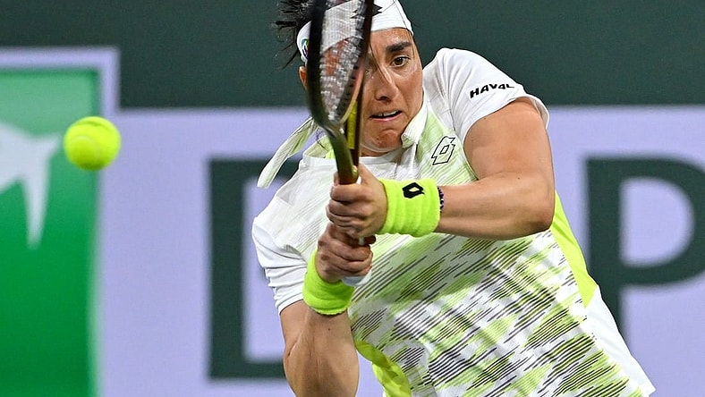 Mar 11, 2023; Indian Wells, CA, USA;  Ons Jabeur (TUN) hits a shot during her second round match against Magdalena Frech (POL) in the BNP Paribas Open at the Indian Wells Tennis Garden. Mandatory Credit: Jayne Kamin-Oncea-USA TODAY Sports