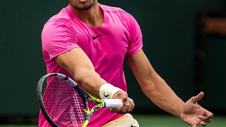 Carlos Alcaraz of Spain hits to Daniil Medvedev of Russia during the men's singles final at the BNP Paribas Open of the Indian Wells Tennis Garden in Indian Wells, Calif., Sunday, March 19, 2023.