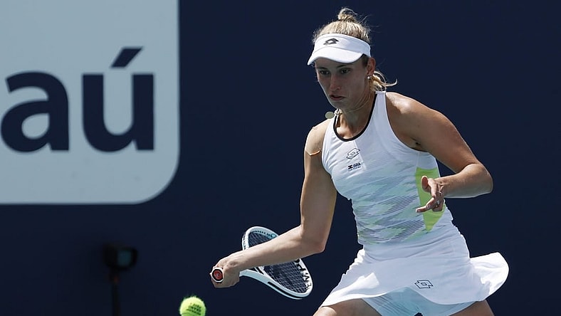 Mar 23, 2023; Miami, Florida, US; Elise Mertens (BEL) hits a forehand against Daria Kasatkina (not pictured) on day four of the Miami Open at Hard Rock Stadium. Mandatory Credit: Geoff Burke-USA TODAY Sports