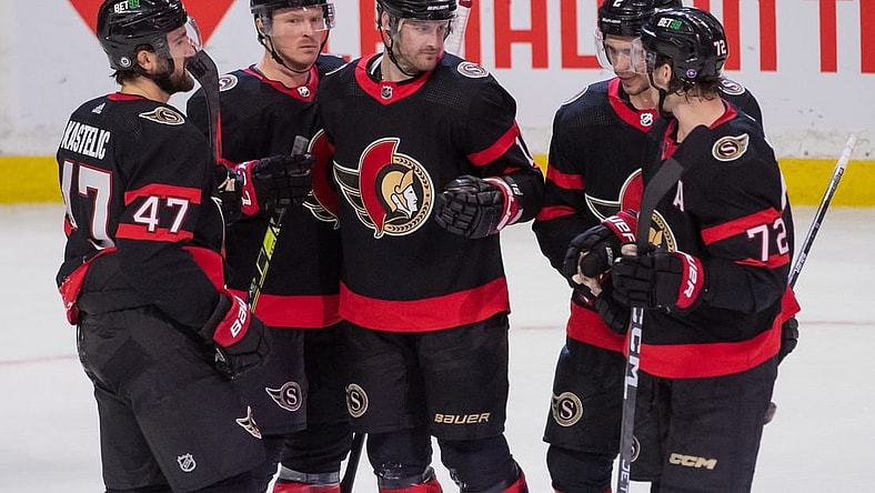 Mar 23, 2023; Ottawa, Ontario, CAN; Ottawa Senators left wing Austin Watson (16) celebrates with team his goal scored in the third period against the Tampa Bay Lightning at the Canadian Tire Centre. Mandatory Credit: Marc DesRosiers-USA TODAY Sports