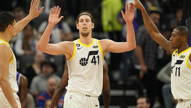 Mar 25, 2023; Sacramento, California, USA; Utah Jazz forward Kelly Olynyk (41) celebrates with forward Simone Fontecchio (left) and guard Kris Dunn (11) during the second quarter against the Sacramento Kings at Golden 1 Center. Mandatory Credit: Darren Yamashita-USA TODAY Sports
