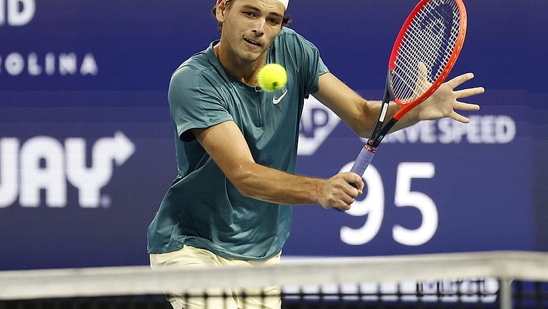 Mar 30, 2023; Miami, Florida, US; Taylor Fritz (USA) hits a volley against Carlos Alcaraz (ESP) (not pictured) in a men's singles quarterfinal on day eleven of the Miami Open at Hard Rock Stadium. Mandatory Credit: Geoff Burke-USA TODAY Sports