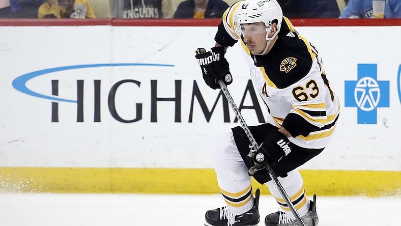 Apr 1, 2023; Pittsburgh, Pennsylvania, USA;  Boston Bruins left wing Brad Marchand (63) skates with the puck against the Pittsburgh Penguins during the third period at PPG Paints Arena. Boston won 4-3. Mandatory Credit: Charles LeClaire-USA TODAY Sports