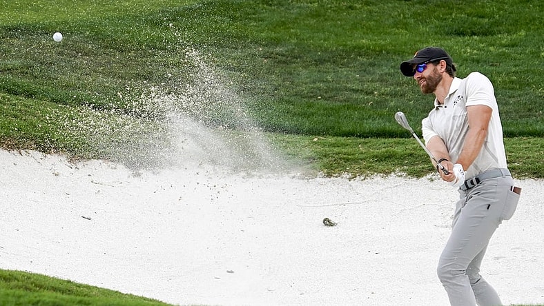 Apr 1, 2023; San Antonio, Texas, USA; Patrick Rodgers plays a shot from a bunker on the 18th hole during the third round of the Valero Texas Open golf tournament. Mandatory Credit: Raymond Carlin III-USA TODAY Sports