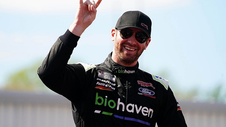 Apr 2, 2023; Richmond, Virginia, USA; Cody Ware waves to fans before the race during the Toyota Owners 400 at Richmond Raceway. Mandatory Credit: John David Mercer-USA TODAY Sports