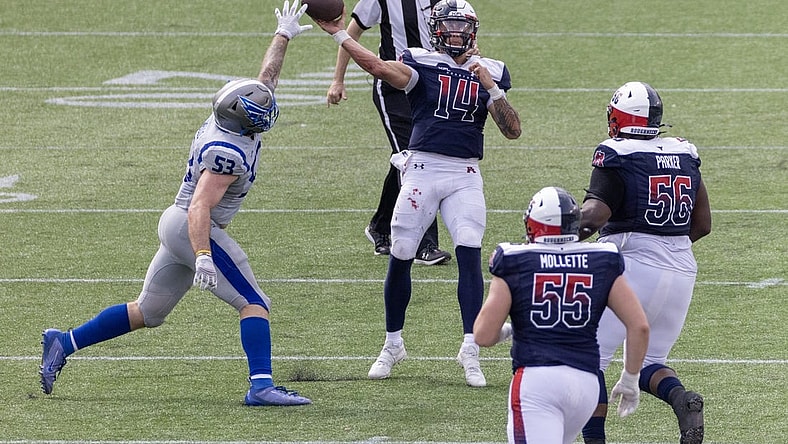 Apr 2, 2023; Houston, TX, USA;  Houston Roughnecks quarterback Cole McDonald (14) pass is deflected by St. Louis Battlehawks  linebacker Carson Wells (53) in the fourth quarter at TDECU Stadium. Mandatory Credit: Thomas Shea-USA TODAY Sports