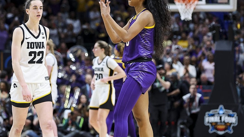 Apr 2, 2023; Dallas, TX, USA; LSU Lady Tigers forward Angel Reese (10) gestures towards Iowa Hawkeyes guard Caitlin Clark (22) in the second half during the final round of the Women's Final Four NCAA tournament at the American Airlines Center. Mandatory Credit: Kevin Jairaj-USA TODAY Sports