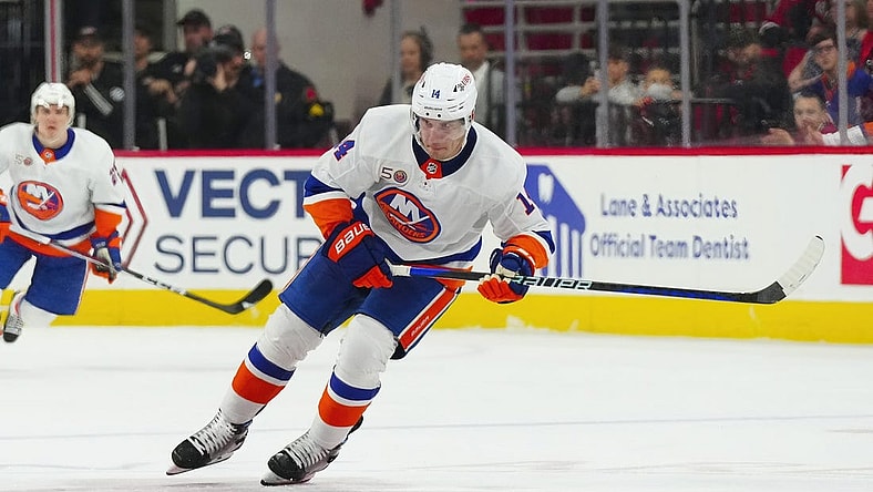 Apr 2, 2023; Raleigh, North Carolina, USA;  New York Islanders center Bo Horvat (14) skates with the puck against the Carolina Hurricanes during the second period at PNC Arena. Mandatory Credit: James Guillory-USA TODAY Sports