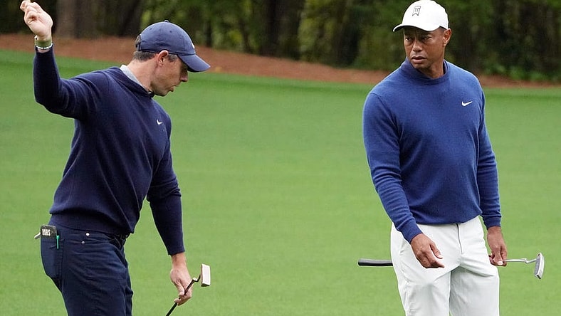 Apr 3, 2023; Augusta, Georgia, USA; Rory McIlroy and Tiger Woods chat on the no. 11 fairway after hitting their approach shots during a practice round for The Masters golf tournament at Augusta National Golf Club. Mandatory Credit: Kyle Terada-USA TODAY Network
