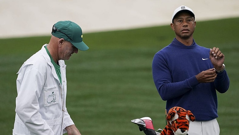 Apr 3, 2023; Augusta, Georgia, USA; Tiger Woods warms up on the practice range alongside caddie Joe LaCava during a practice round for The Masters golf tournament at Augusta National Golf Club. Mandatory Credit: Katie Goodale-USA TODAY Network

Pga The Masters Practice Round