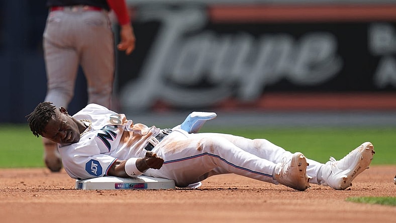 Apr 5, 2023; Miami, Florida, USA;  Miami Marlins center fielder Jazz Chisholm Jr. (2) gets up slowly after getting tagged out trying to steal second base in the first inning against the Minnesota Twins at loanDepot Park. Mandatory Credit: Jim Rassol-USA TODAY Sports