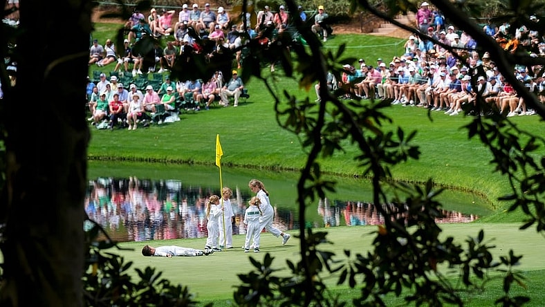 Apr 5, 2023; Augusta, Georgia, USA; Kevin Kisner and Gary Woodland's children play on the no. 8 green during the Par 3 Contest at The Masters golf tournament at Augusta National Golf Club. Mandatory Credit: Danielle Parhizkaran-USA TODAY Network

Pga Par 3 Contest