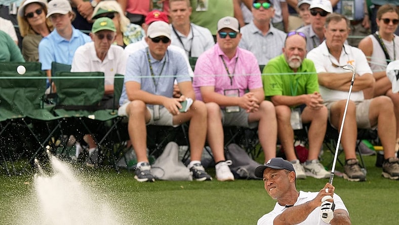 Apr 6, 2023; Augusta, Georgia, USA; Tiger Woods plays a shot from a bunker on the 18th hole during the first round of The Masters golf tournament. Mandatory Credit: Michael Madrid-USA TODAY Network

Pga Masters Tournament First Round