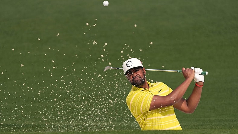 Apr 7, 2023; Augusta, Georgia, USA; Tony Finau plays a shot from a bunker on the second hole during the second round of The Masters golf tournament. Mandatory Credit: Michael Madrid-USA TODAY Network