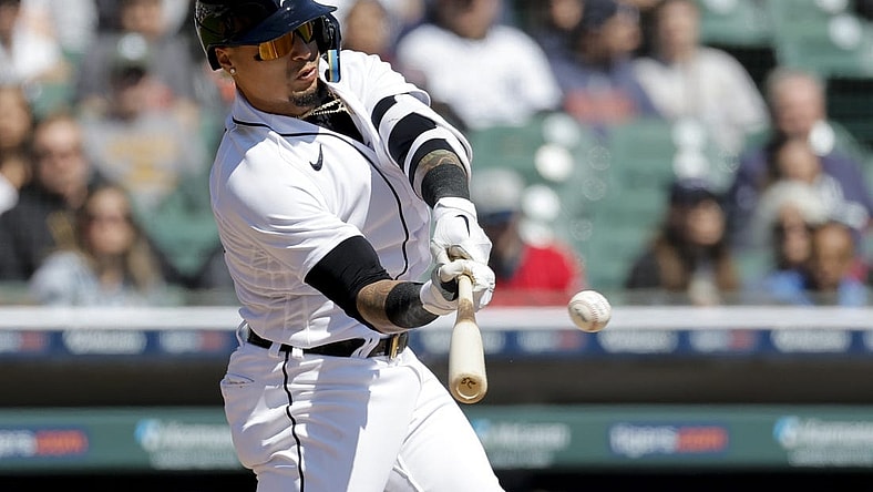 Apr 9, 2023; Detroit, Michigan, USA; Detroit Tigers shortstop Javier Baez (28) hits a single in the third inning against the Boston Red Sox at Comerica Park. Mandatory Credit: Rick Osentoski-USA TODAY Sports