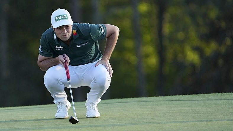 Apr 9, 2023; Augusta, Georgia, USA; Viktor Hovland lines up his putt on the 18th green during the final round of The Masters golf tournament. Mandatory Credit: Danielle Parhizkaran-USA TODAY Network