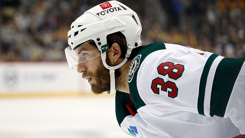 Apr 6, 2023; Pittsburgh, Pennsylvania, USA;  Minnesota Wild right wing Ryan Hartman (38) looks on at the face-off circle against the Pittsburgh Penguins during the first period at PPG Paints Arena. Mandatory Credit: Charles LeClaire-USA TODAY Sports