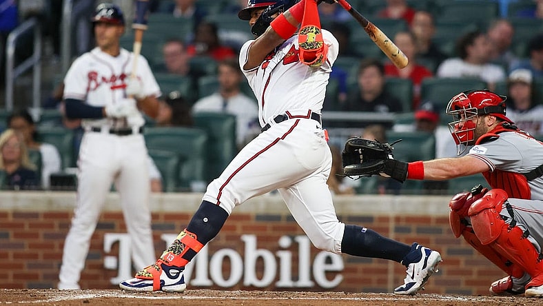 Apr 11, 2023; Atlanta, Georgia, USA; Atlanta Braves right fielder Ronald Acuna Jr. (13) hits an RBI single against the Cincinnati Reds in the third inning at Truist Park. Mandatory Credit: Brett Davis-USA TODAY Sports