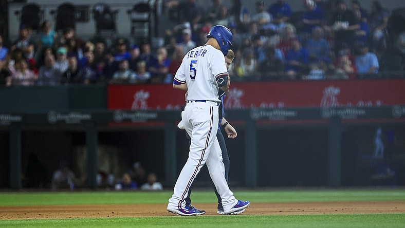 Apr 11, 2023; Arlington, Texas, USA;  Texas Rangers shortstop Corey Seager (5) leaves the game with an injury during the fifth inning against the Kansas City Royals at Globe Life Field. Mandatory Credit: Kevin Jairaj-USA TODAY Sports