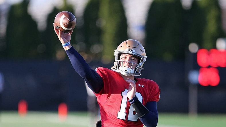 Notre Dame quarterback Tyler Buchner (12) throws a pass Wednesday, April 12, 2023, during spring football practice on the Notre Dame campus.

Nd Spring Football