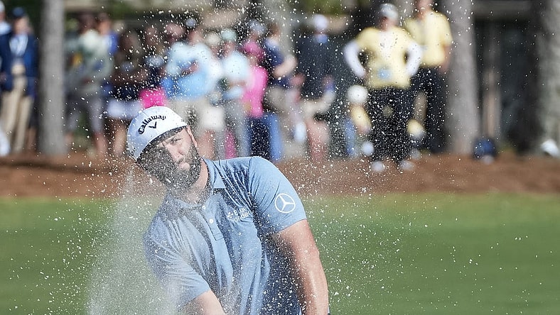 Apr 13, 2023; Hilton Head, South Carolina, USA; Jon Rahm plays from the bunker on the 9th hole during the first round of the RBC Heritage golf tournament. Mandatory Credit: David Yeazell-USA TODAY Sports