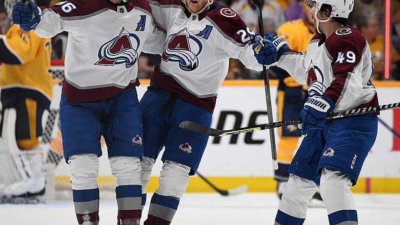 Apr 14, 2023; Nashville, Tennessee, USA; Colorado Avalanche center Nathan MacKinnon (29) celebrates with right wing Mikko Rantanen (96) and defenseman Samuel Girard (49) celebrate after scoring the game-winning goal during the third period against the Nashville Predators at Bridgestone Arena. Mandatory Credit: Christopher Hanewinckel-USA TODAY Sports