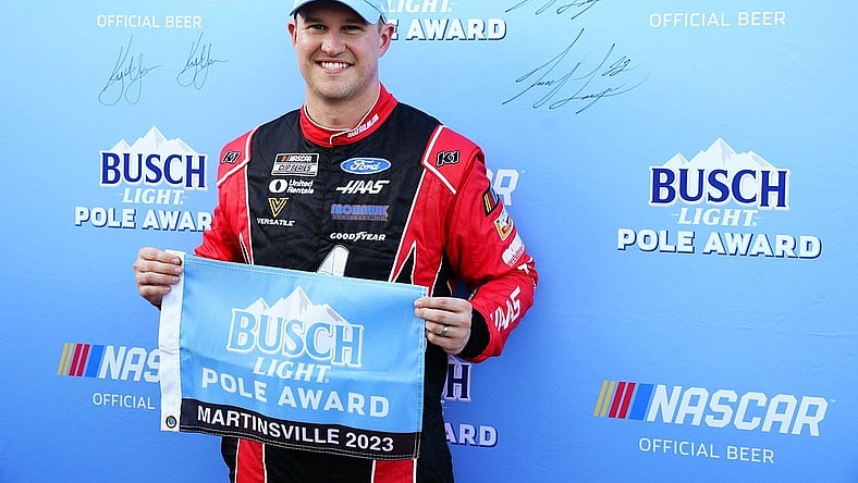 Apr 15, 2023; Martinsville, Virginia, USA; NASCAR Cup Series driver Ryan Preece (41) holds the pole award flag after capturing the pole during qualifying at Martinsville Speedway. Mandatory Credit: John David Mercer-USA TODAY Sports
