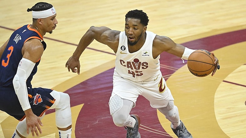 Apr 15, 2023; Cleveland, Ohio, USA; Cleveland Cavaliers guard Donovan Mitchell (45) dribbles beside New York Knicks guard Josh Hart (3) in the second quarter of game one of the 2023 NBA playoffs at Rocket Mortgage FieldHouse. Mandatory Credit: David Richard-USA TODAY Sports