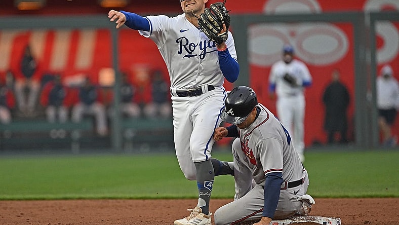 Apr 15, 2023; Kansas City, Missouri, USA;  Kansas City Royals second baseman Michael Massey (19) throws to first base for a double play over Atlanta Braves second baseman Ozzie Albies (1) during the third inning at Kauffman Stadium. Mandatory Credit: Peter Aiken-USA TODAY Sports