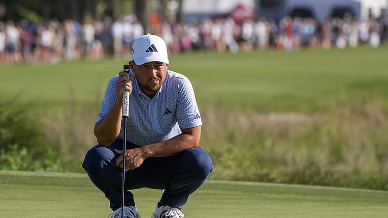 Apr 15, 2023; Hilton Head, South Carolina, USA; Xander Schauffele lines up a putt on the 18th green during the third round of the RBC Heritage golf tournament. Mandatory Credit: David Yeazell-USA TODAY Sports