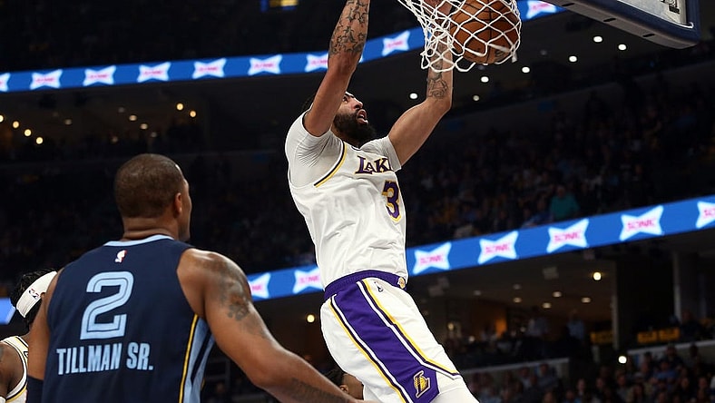 Apr 16, 2023; Memphis, Tennessee, USA; Los Angeles Lakers forward Anthony Davis (3) dunks during the first half during Game 1 of the 2023 NBA playoffs against the Memphis Grizzlies at FedExForum. Mandatory Credit: Petre Thomas-USA TODAY Sports