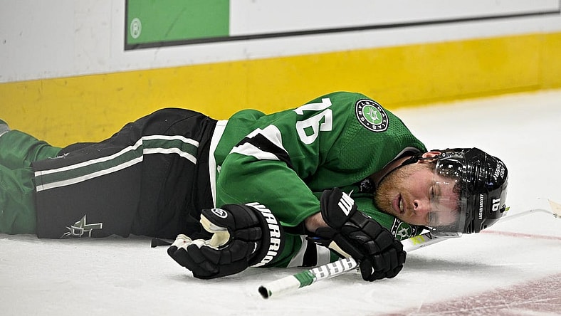 Apr 17, 2023; Dallas, Texas, USA; Dallas Stars center Joe Pavelski (16) lies on the ice after getting hit by Minnesota Wild defenseman Matt Dumba (not pictured) during the second period in game one of the first round of the 2023 Stanley Cup Playoffs at the American Airlines Center. Mandatory Credit: Jerome Miron-USA TODAY Sports