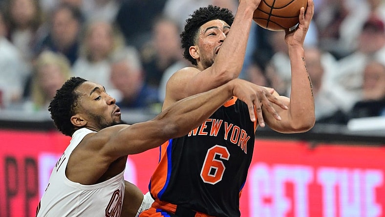 Apr 18, 2023; Cleveland, Ohio, USA; Cleveland Cavaliers guard Donovan Mitchell (45) fouls New York Knicks guard Quentin Grimes (6) during the first quarter of game two of the 2023 NBA playoffs at Rocket Mortgage FieldHouse. Mandatory Credit: Ken Blaze-USA TODAY Sports