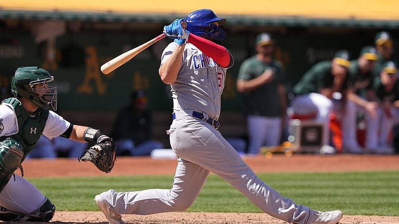Apr 19, 2023; Oakland, California, USA; Chicago Cubs first baseman Eric Hosmer (51) hits a home run against the Oakland Athletics during the eighth inning at Oakland-Alameda County Coliseum. Mandatory Credit: Darren Yamashita-USA TODAY Sports