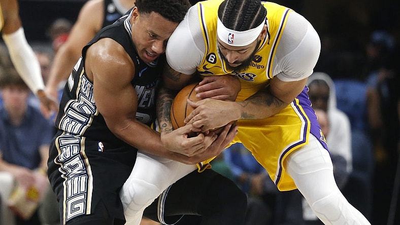 Apr 19, 2023; Memphis, Tennessee, USA; Memphis Grizzlies guard Desmond Bane (22) and Los Angeles Lakers forward Anthony Davis (3) fight for control of the ball during the first half during game two of the 2023 NBA playoffs at FedExForum. Mandatory Credit: Petre Thomas-USA TODAY Sports