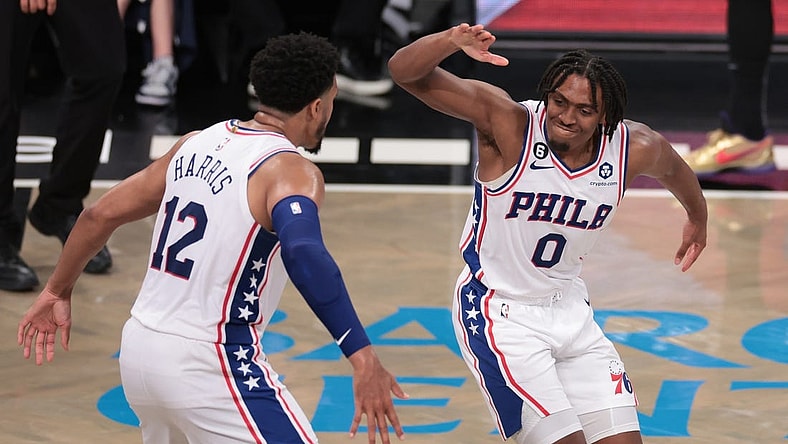 Apr 22, 2023; Brooklyn, New York, USA; Philadelphia 76ers guard Tyrese Maxey (0) celebrates with forward Tobias Harris (12) after a basket against the Brooklyn Nets during the second half of game four of the 2023 NBA playoffs at Barclays Center. Mandatory Credit: Vincent Carchietta-USA TODAY Sports