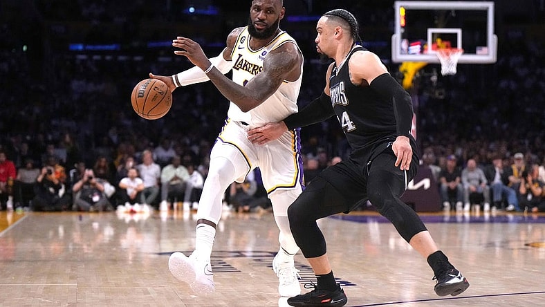 Apr 22, 2023; Los Angeles, California, USA; Los Angeles Lakers forward LeBron James (6) dribbles the ball against Memphis Grizzlies forward Dillon Brooks (24) in the second quarter during game three of the 2023 NBA playoffs at Crypto.com Arena. Mandatory Credit: Kirby Lee-USA TODAY Sports