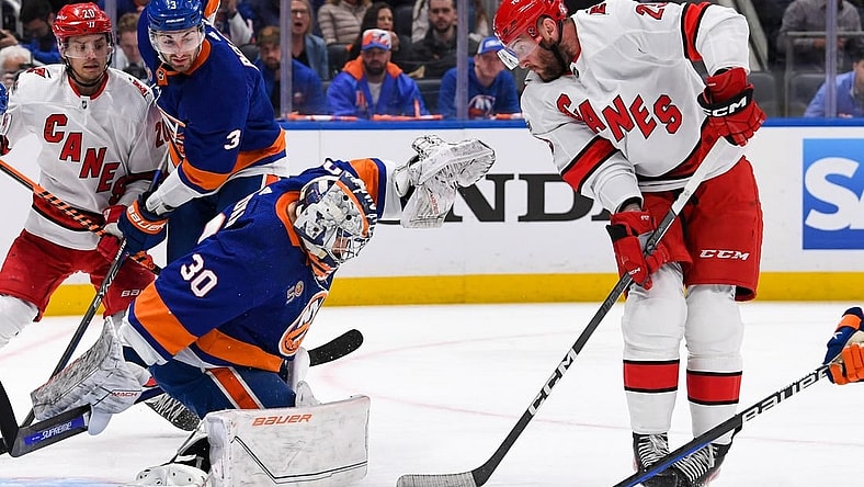 Apr 23, 2023; Elmont, New York, USA; Carolina Hurricanes right wing Stefan Noesen (23) plays the puck in front of New York Islanders goaltender Ilya Sorokin (30) during the first period in game four of the first round of the 2023 Stanley Cup Playoffs at UBS Arena. Mandatory Credit: Dennis Schneidler-USA TODAY Sports
