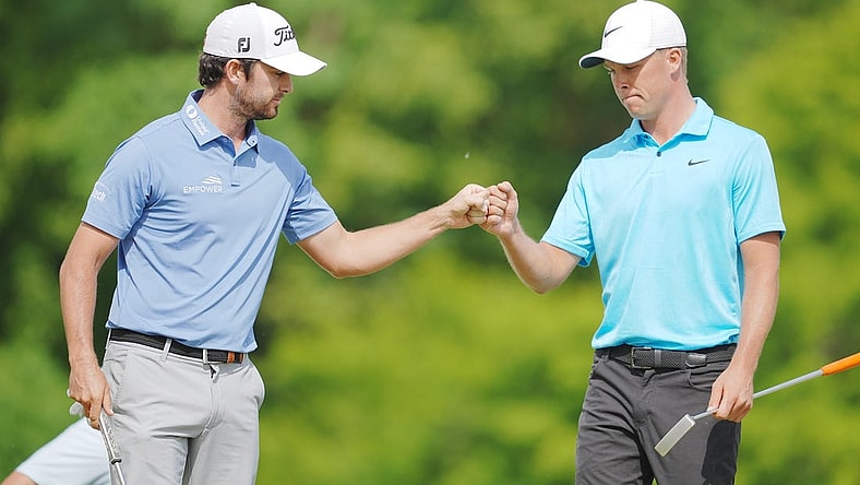 Apr 23, 2023; Avondale, Louisiana, USA; Davis Riley fist bumps Nick Hardy on the 16th green during the final round of the Zurich Classic of New Orleans golf tournament. Mandatory Credit: Andrew Wevers-USA TODAY Sports