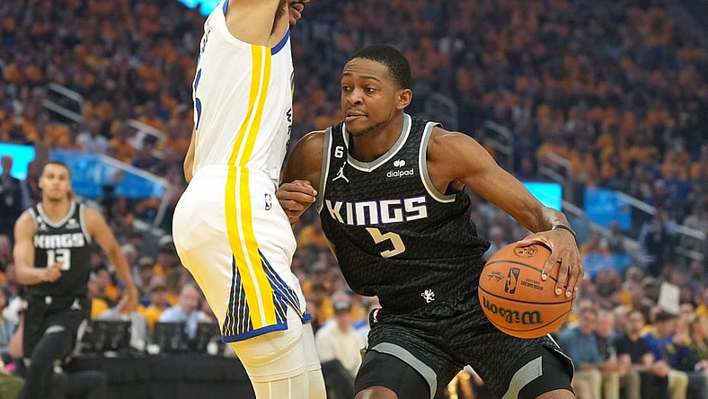 Apr 23, 2023; San Francisco, California, USA; Sacramento Kings guard De'Aaron Fox (5) dribbles against Golden State Warriors guard Jordan Poole (left) during the first quarter of game four of the 2023 NBA playoffs at Chase Center. Mandatory Credit: Darren Yamashita-USA TODAY Sports