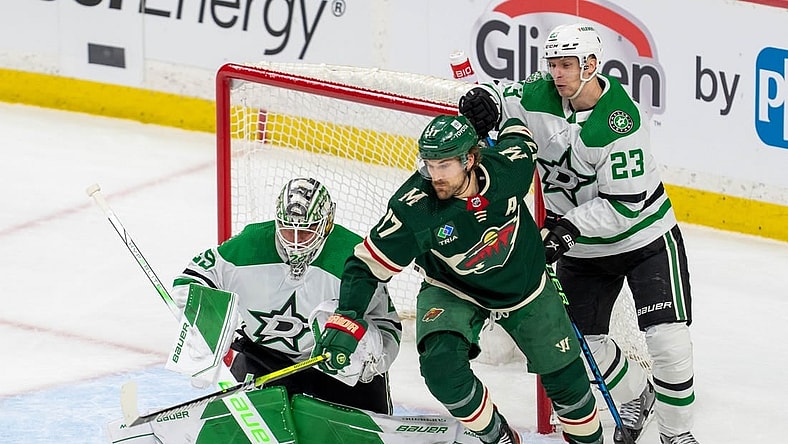 Apr 21, 2023; Saint Paul, Minnesota, USA; Minnesota Wild left wing Marcus Foligno (17) and Dallas Stars defenseman Esa Lindell (23) and goaltender Jake Oettinger (29) in the first period of game three of the first round of the 2023 Stanley Cup Playoffs at Xcel Energy Center. Mandatory Credit: Matt Blewett-USA TODAY Sports