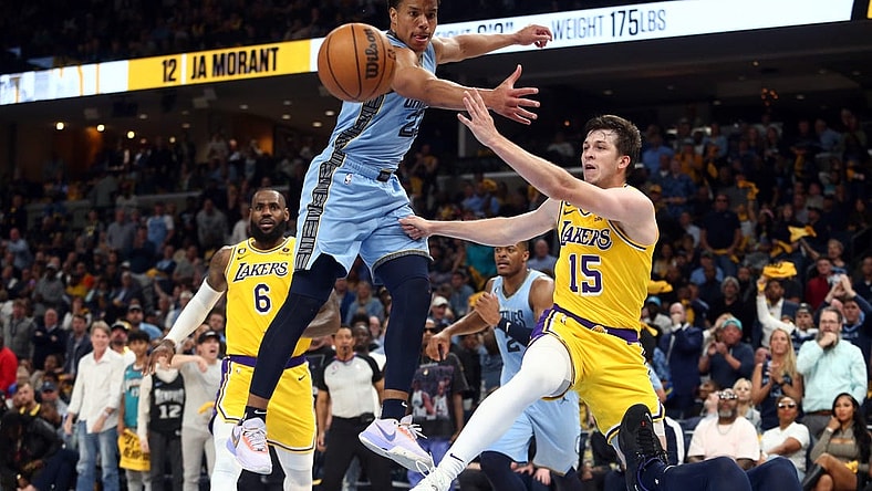 Apr 26, 2023; Memphis, Tennessee, USA; Los Angeles Lakers guard Austin Reaves (15) passes the ball as Memphis Grizzlies guard Desmond Bane (22) defends during the first half during game five of the 2023 NBA playoffs at FedExForum. Mandatory Credit: Petre Thomas-USA TODAY Sports