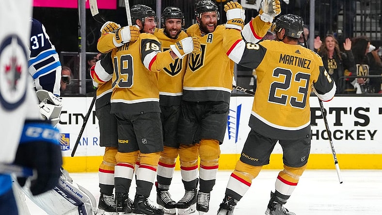 Apr 27, 2023; Las Vegas, Nevada, USA; Vegas Golden Knights right wing Reilly Smith (19), right wing Michael Amadio (22), defenseman Alex Pietrangelo (7), and defenseman Alec Martinez (23) celebrate a goal scored by center William Karlsson (71) during the second period against the Winnipeg Jets in game five of the first round of the 2023 Stanley Cup Playoffs at T-Mobile Arena. Mandatory Credit: Stephen R. Sylvanie-USA TODAY Sports