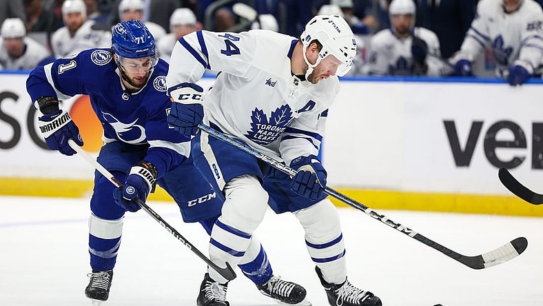 Apr 29, 2023; Tampa, Florida, USA; Toronto Maple Leafs defenseman Morgan Rielly (44) keeps the puck from Tampa Bay Lightning center Anthony Cirelli (71) in the first period  during game six of the first round of the 2023 Stanley Cup Playoffs at Amalie Arena. Mandatory Credit: Nathan Ray Seebeck-USA TODAY Sports