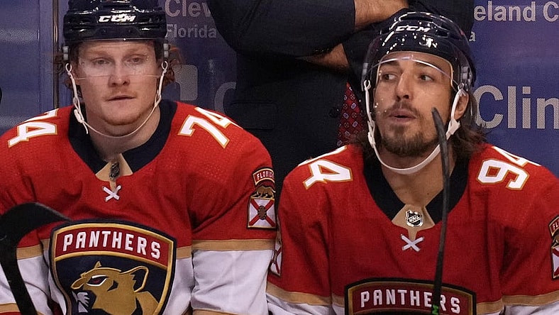 Oct 16, 2021; Sunrise, Florida, USA; Florida Panthers head coach Joel Quenneville watches the game behind right wing Owen Tippett (74) and left wing Ryan Lomberg (94) during the third period against the New York Islanders at FLA Live Arena. Mandatory Credit: Jasen Vinlove-USA TODAY Sports