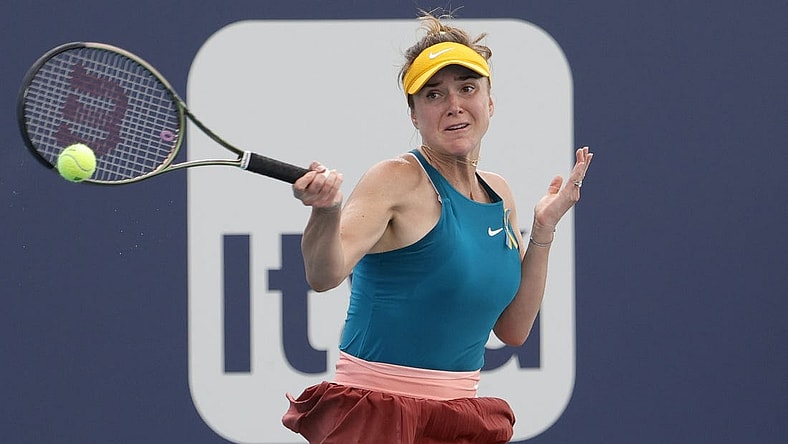 Mar 24, 2022; Miami Gardens, FL, USA; Elina Svitolina (UKR) hits a forehand against Heather Watson (GBR) (not pictured) in a second round women's singles match in the Miami Open at Hard Rock Stadium. Mandatory Credit: Geoff Burke-USA TODAY Sports