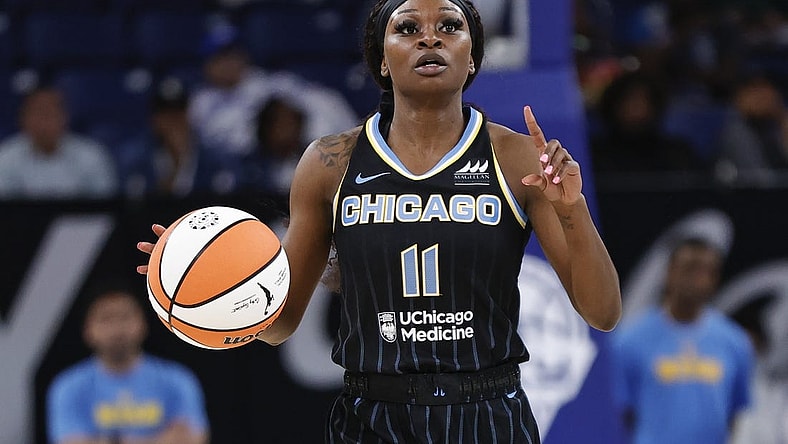 May 24, 2022; Chicago, Illinois, USA; Chicago Sky guard Dana Evans (11) brings the ball up court against the Indiana Fever during the first half at Wintrust Arena. Mandatory Credit: Kamil Krzaczynski-USA TODAY Sports