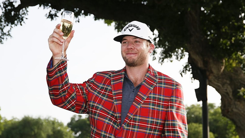 May 29, 2022; Fort Worth, Texas, USA; Sams Burns toasts to his victory following the final round of the Charles Schwab Challenge golf tournament. Mandatory Credit: Raymond Carlin III-USA TODAY Sports