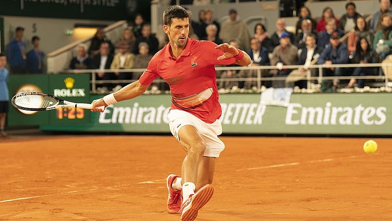 May 31, 2022; Paris, France; Novak Djokovic (SRB) returns a shot during his match against Rafael Nadal (ESP) on day 10 of the French Open at Stade Roland-Garros. Mandatory Credit: Susan Mullane-USA TODAY Sports