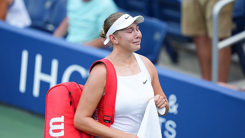 Aug 30, 2022; Flushing, NY, USA; Amanda Anisimova of the United States reacts as she walks off the court after losing her first round match to Yulia Putintseva of Kazakhstan on day two of the 2022 U.S. Open tennis tournament at USTA Billie Jean King National Tennis Center. Mandatory Credit: Danielle Parhizkaran-USA TODAY Sports